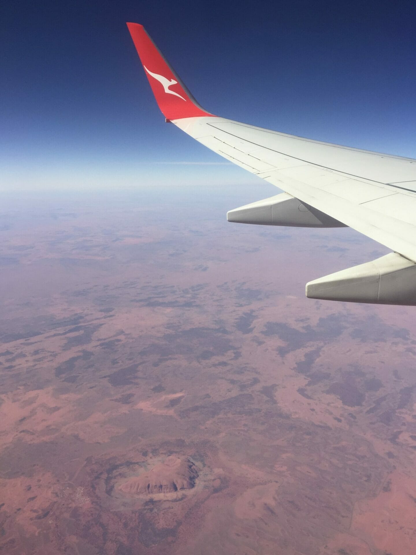 Qantas plane over Uluru Australia