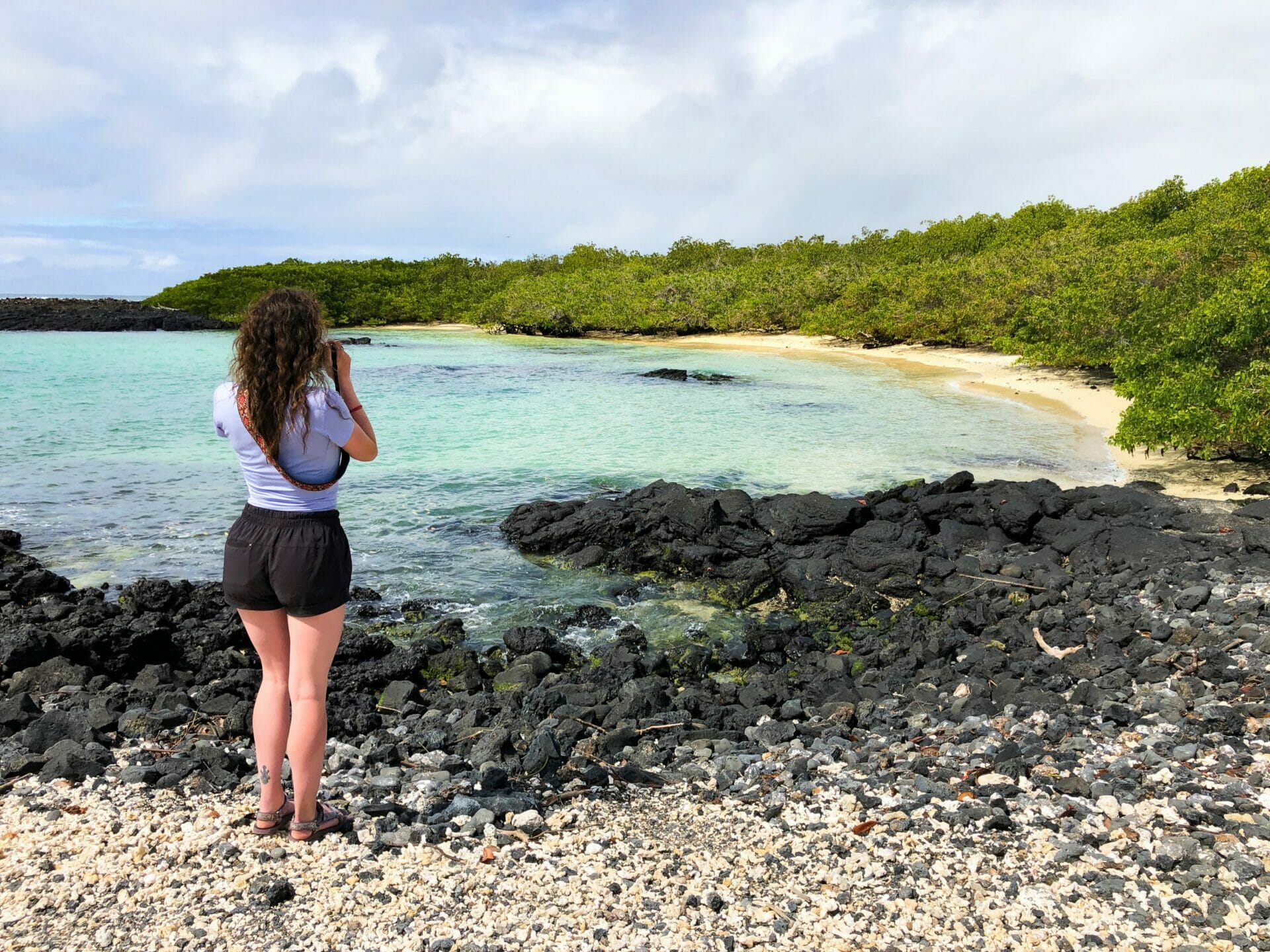 Girl taking photo of beach Isla Isabela