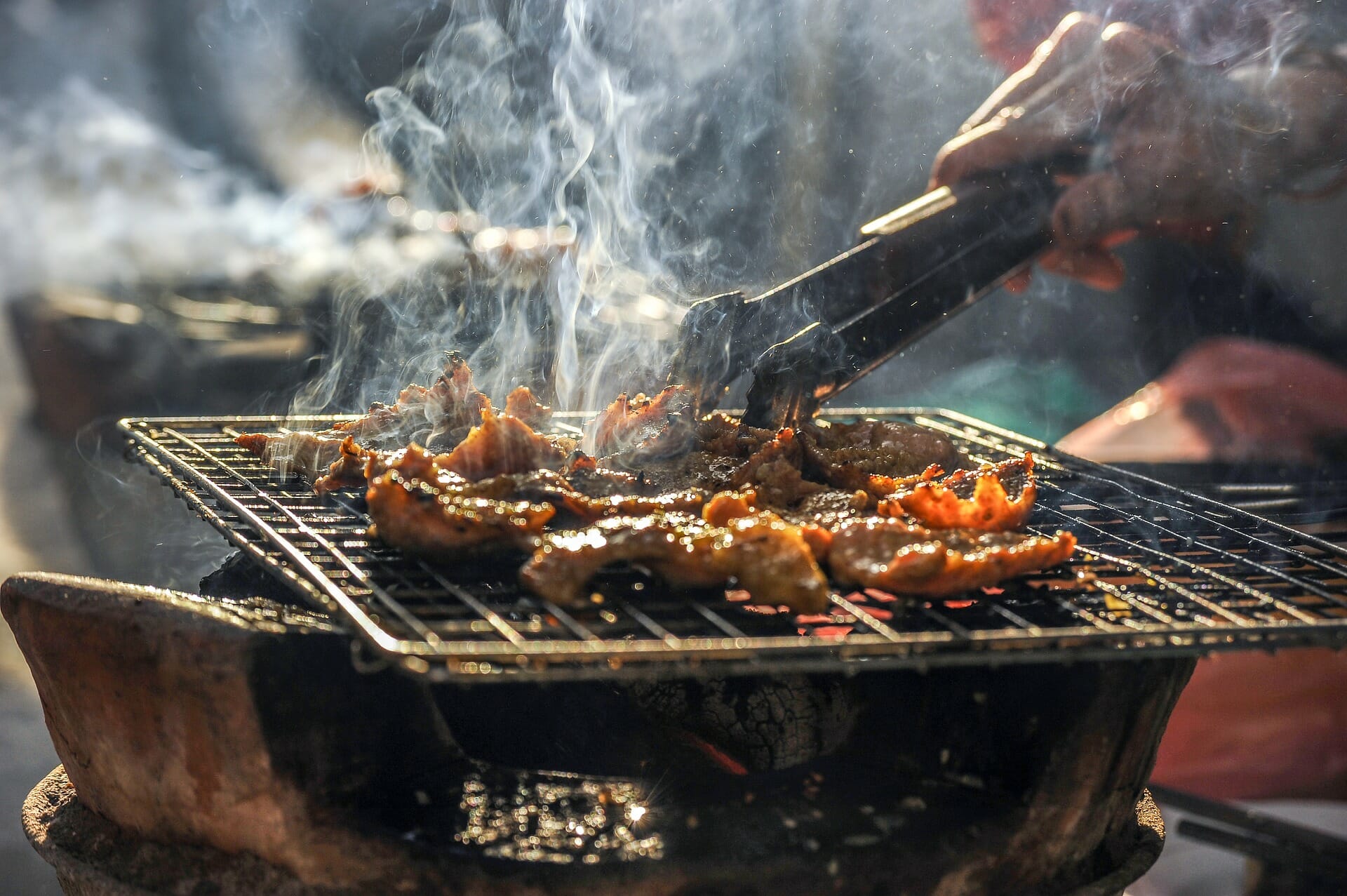 Meat on open grill