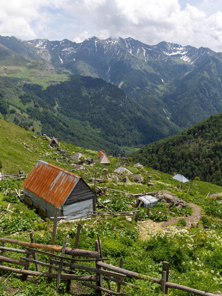Trail passing through summer settlements on Peaks of the Balkans